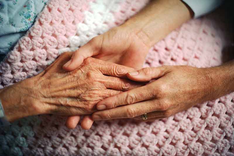 elderly hand holding